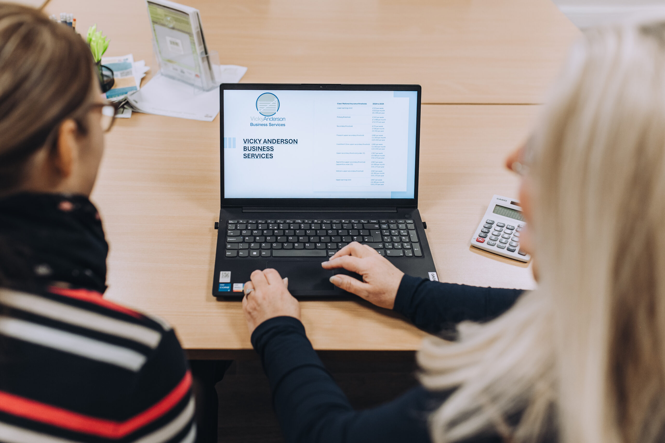 VA demo to person on laptop Employment law and HR Services